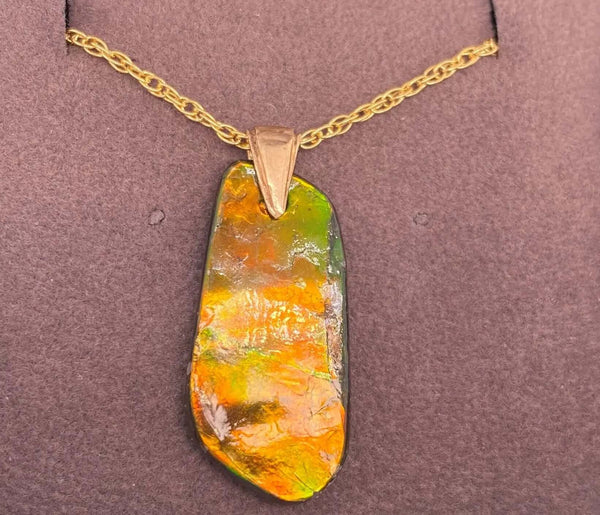 Ammolite Freeform Pendant that is 26X13MM PN E20661