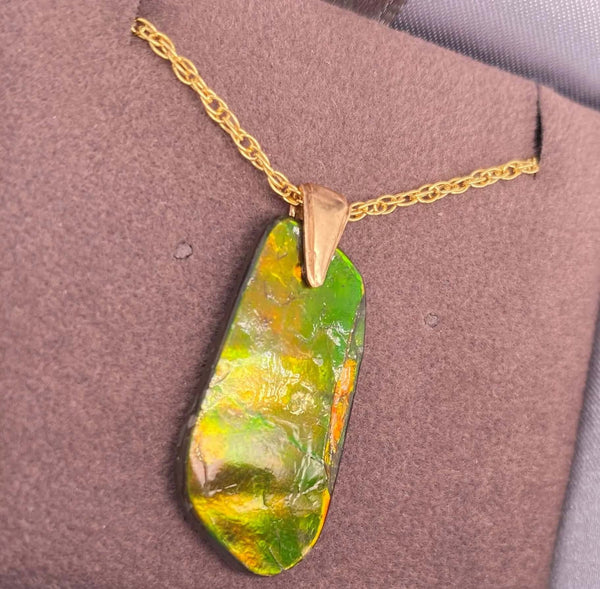 Ammolite Freeform Pendant that is 26X13MM Left View PN E20661