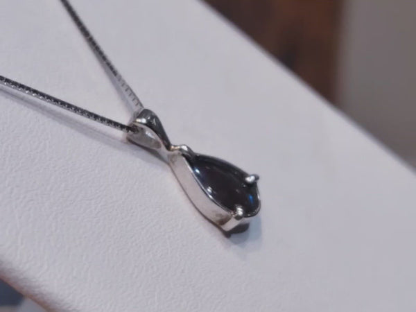 Genuine Alberta Ammolite 6x9mm Green Gemstone In A Petite Pear Silver Pendant.