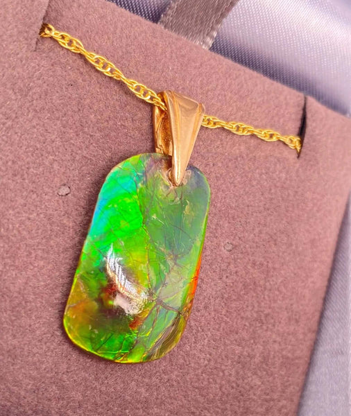 Ammolite Freeform Pendant that is 15X25MM Left View PN E1379 