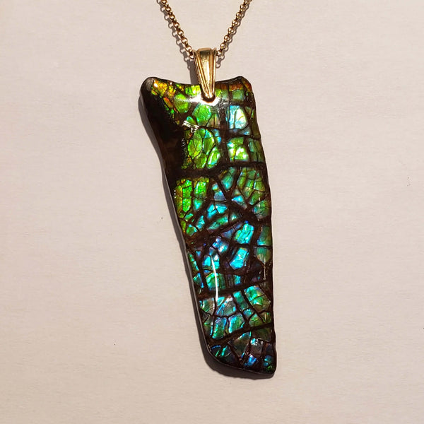 Ammolite Freeform Pendant that is 48x17mm Front View PN E1343