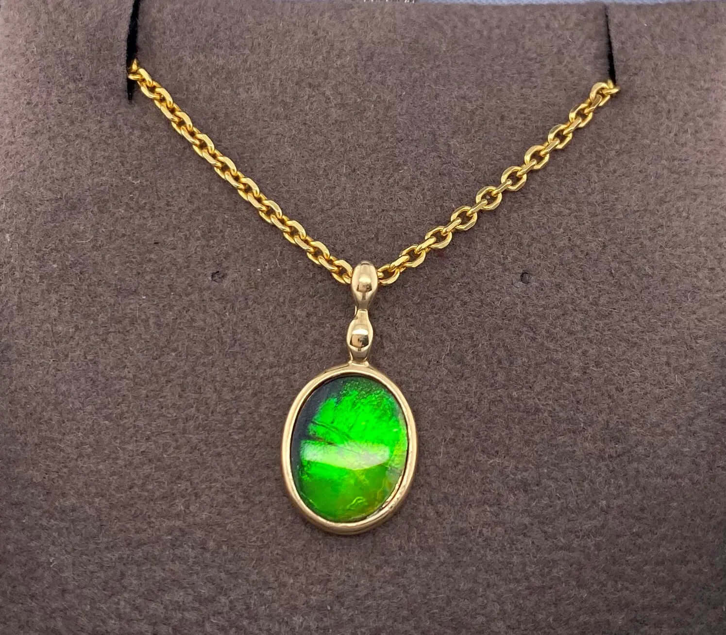 Ammolite Gold Oval Pendant with 8x10mm Gemstone Front View PN E1361Z 