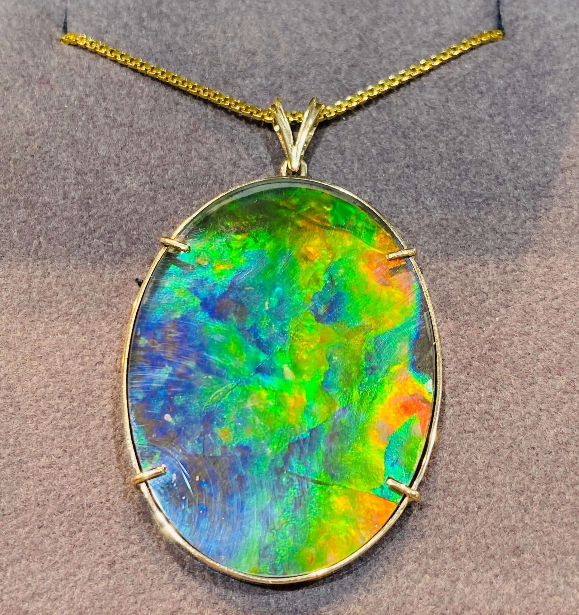 Ammolite Gold Pendant that is 30x40mm Oval PN E21281 %product from Empire Ammolite