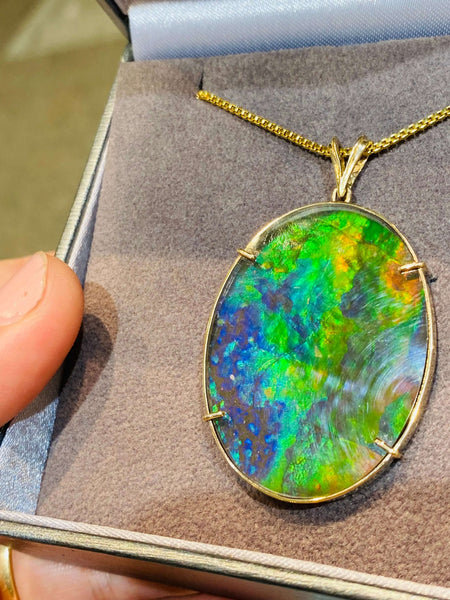 Ammolite Gold Pendant that is 30x40mm Oval PN E21281 %product from Empire Ammolite