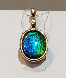 Ammolite Gold Pendant with 8x10mm Oval Gemstone PN: E00421R %product from Empire Ammolite