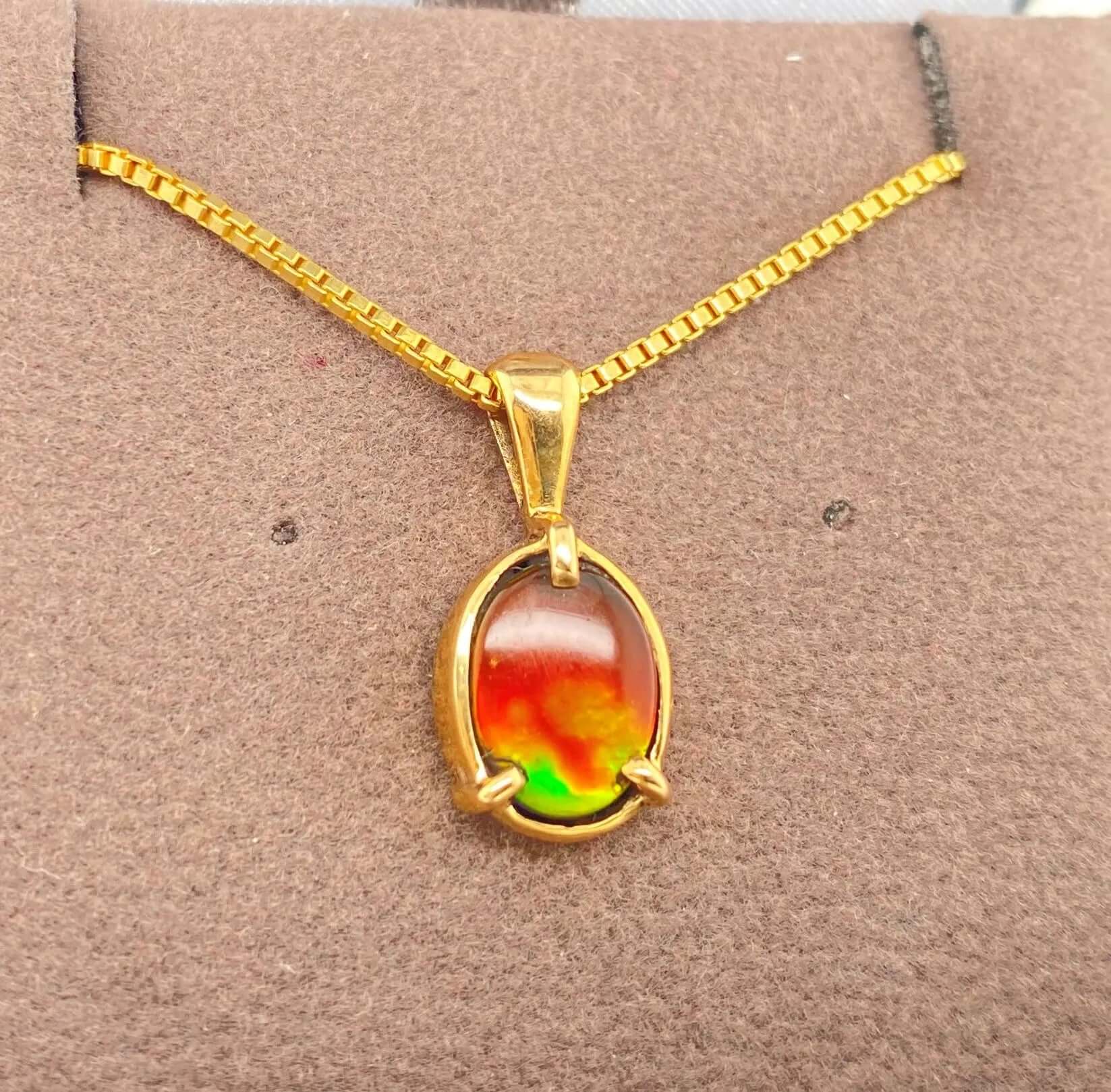 Ammolite Gold Pendant with an Oval Gem Set in 14KYG Left View PN E20824 