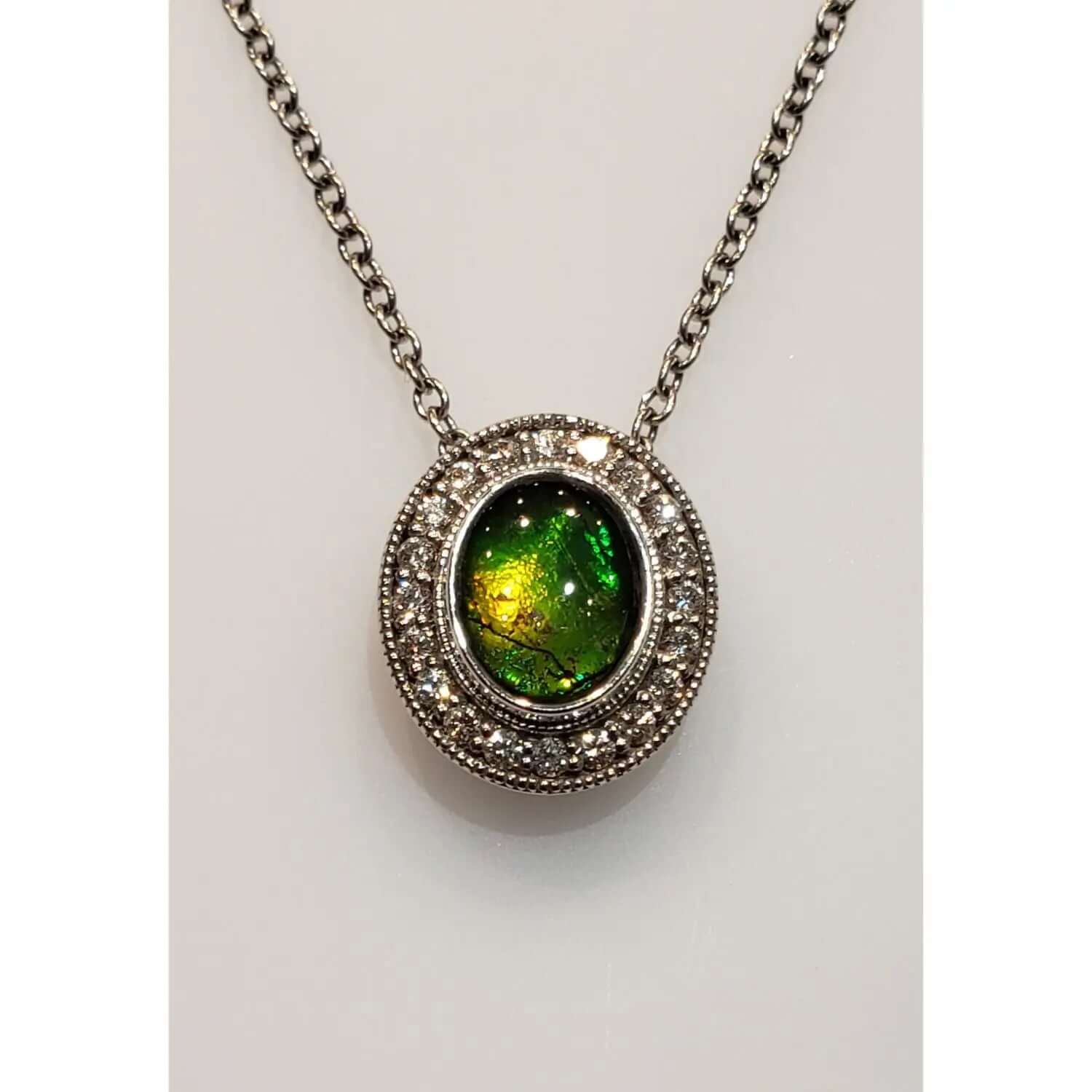 Ammolite Oval Gold Pendant With Diamond Accents PN: E004214 %product from Empire Ammolite
