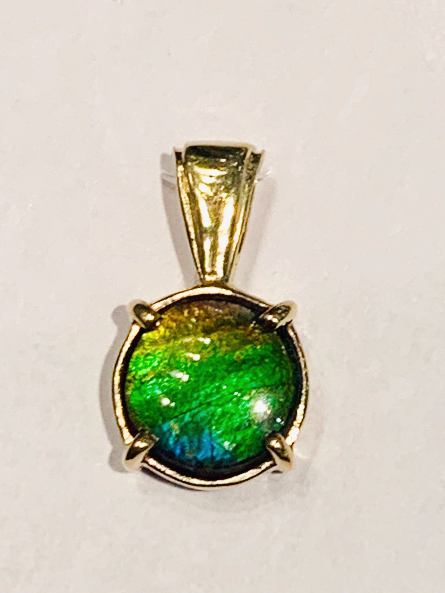Ammolite Round Bezel set Gold Pendant with Green and Blue PN E20791 %product from Empire Ammolite