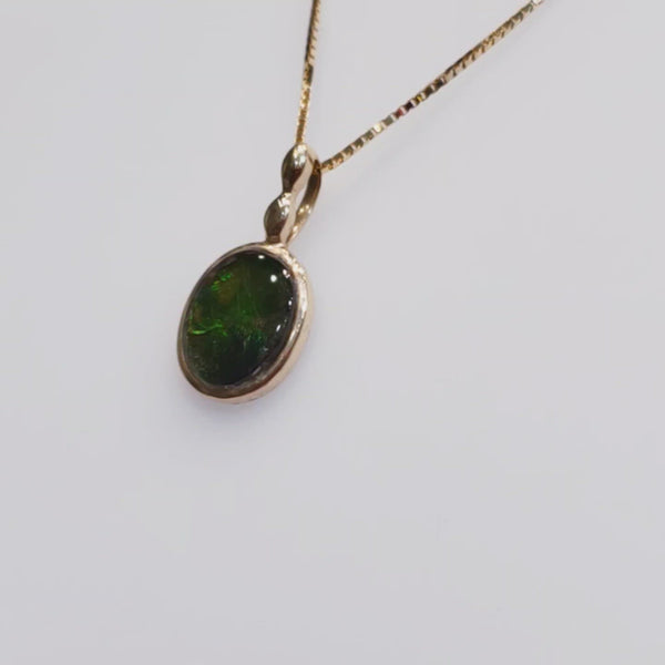 Ammolite Pendant Video with a 6x8mm Oval Gemstone Set in 14KYG 