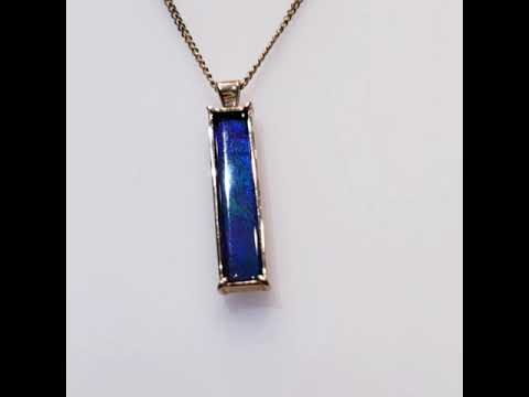 Ammolite Gold Pendant Video with a 5x25mm Rectangle Gemstone and Blue Colour with a touch of Green and Purple